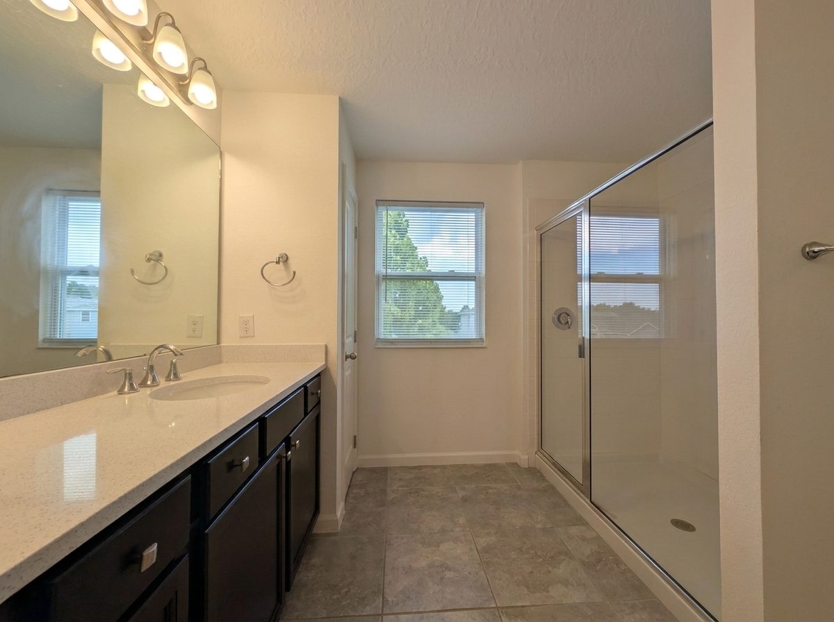 Bathroom with a glass-enclosed shower and vanity at 2275 Abilia Aly, Apopka
