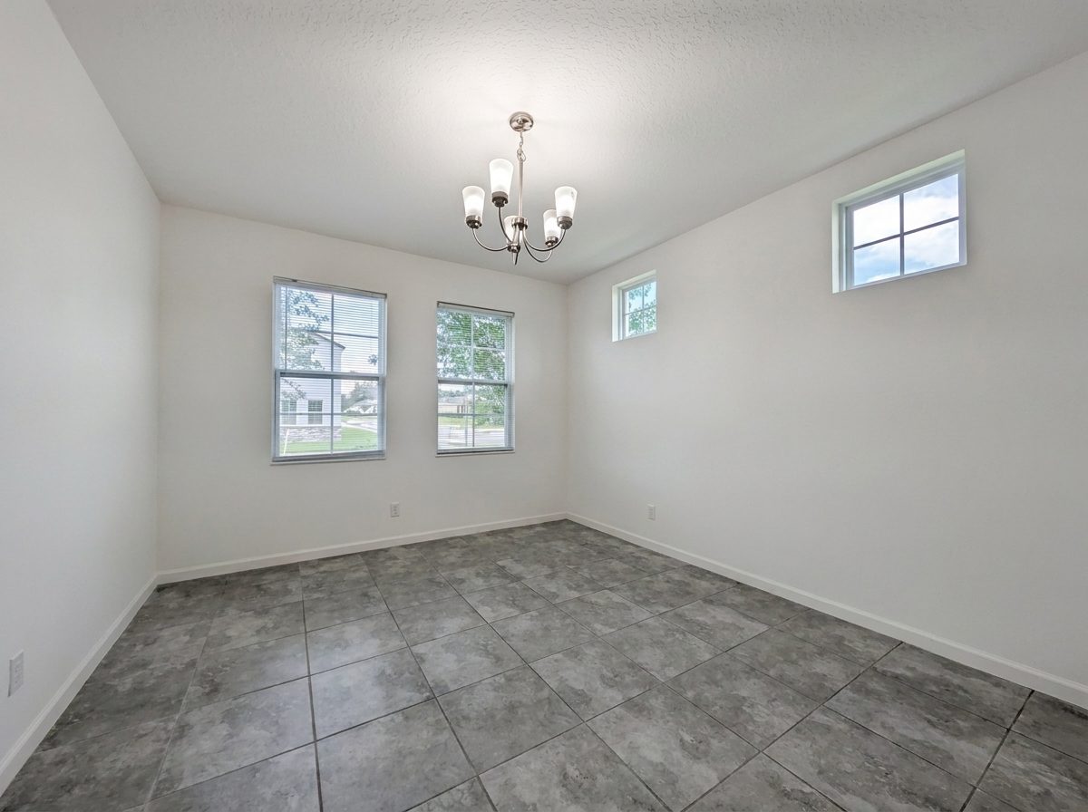 Dining area with a chandelier and natural light at 2275 Abilia Aly, Apopka